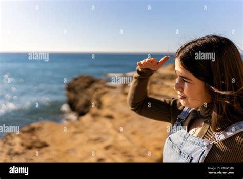 Selective Focus Side View Of Ethnic Female Protecting Eyes From Sun