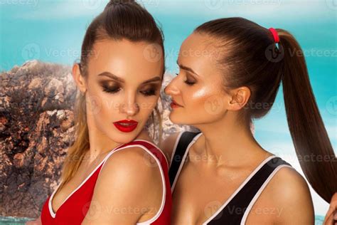 Two Hot Girls Posing On The Beach Stock Photo At Vecteezy