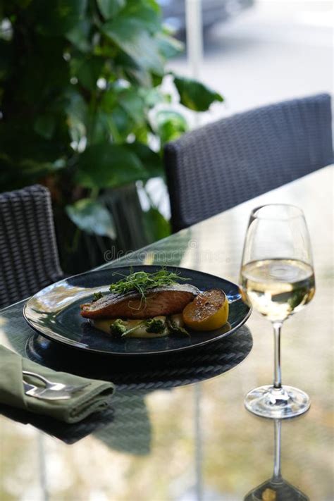 Fried Dorado Fish And Mashed Potato On A Black Plate Stock Image