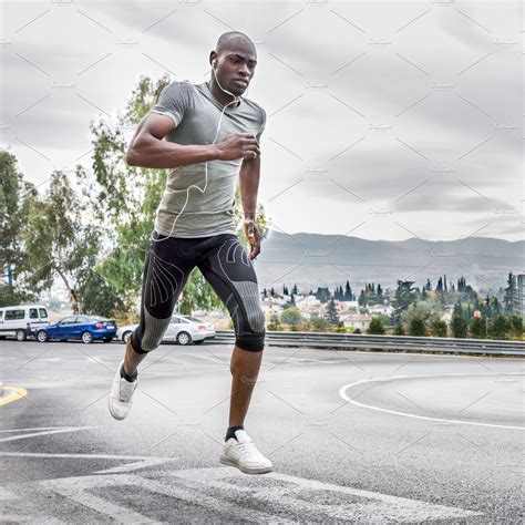 Black man running in the street stock photo containing man and running ...