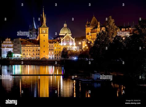 Scenic Night View Of Charles Bridge And Buildings Along The Vltava