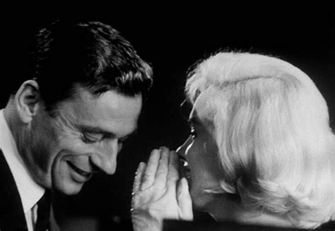 Actress Marilyn Monroe Whispering To Co Star Yves Montand During The