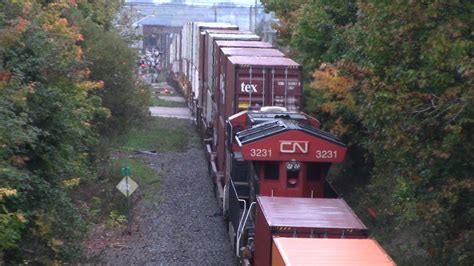 Big Lashup On A Big Stack Train CN 120 W DPU Rolling Thru Downtown