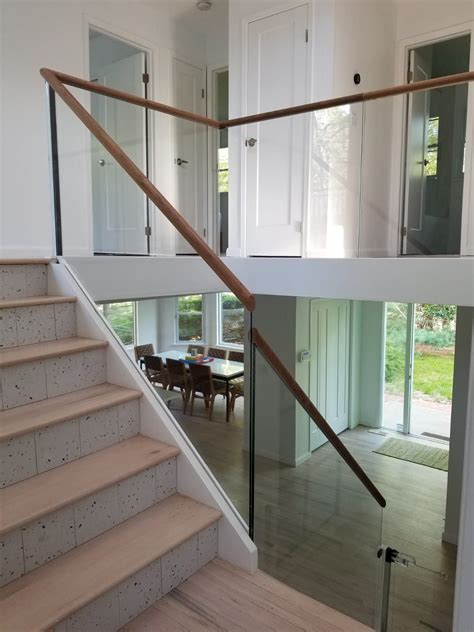 Minimal Glass Railing With A Wood Cap Rail In 2022 Glass Railing