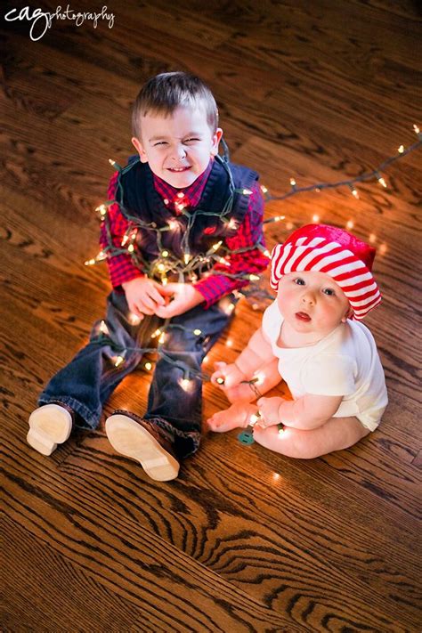 6 Month Old Session Older Brother Wrapped In Lights Siblings