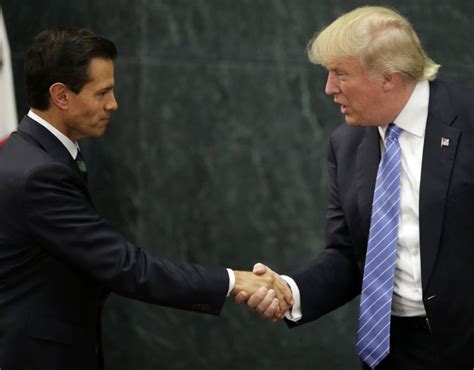 Mexican President Enrique Pena Nieto And Donald Trump Shaking Hands