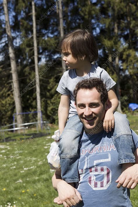 Father Carrying Son On Shoulders Stock Image F Science