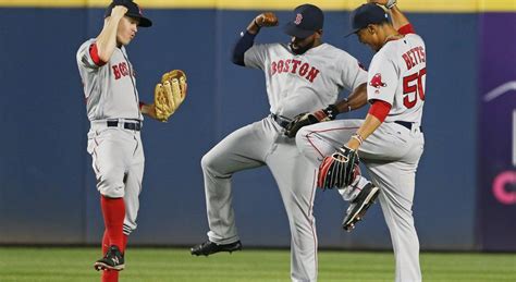 Red Sox Outfielders Celebrate Victory Over Braves