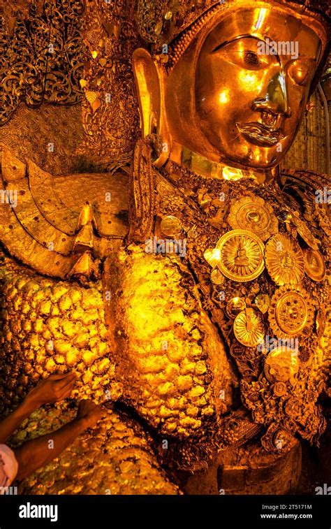 People Stick Gold Leafs On The Golden Mahamuni Buddha Statue Mahamuni