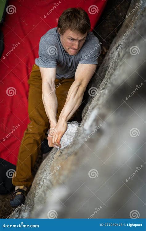 A Rock Climber Climbing on a Boulder Rock Outdoors Stock Image - Image ...