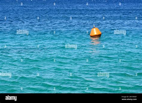 Orange Buoy Floating On The Sea As A Warning To Ships No People Copy