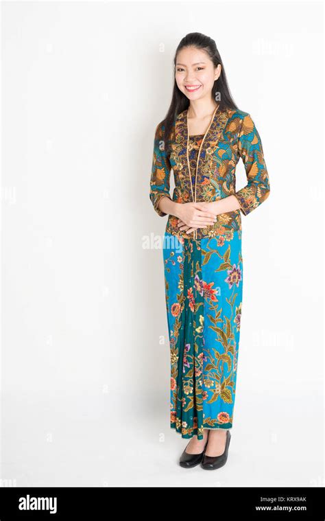 Southeast Asian woman in batik dress Stock Photo - Alamy