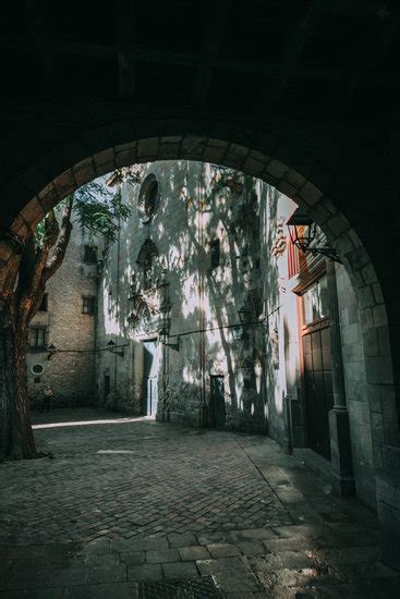 Grey Concrete Building Beside Body Of Water Photos By Canva