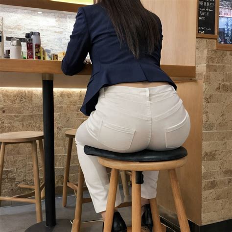 Hot Ass Images Of A Woman Sitting On Stool In A Suit AIHotassFactory