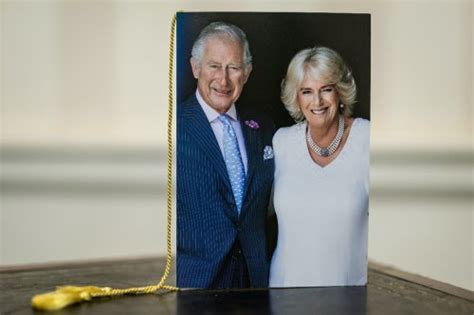 Queen Consort Camilla Poses In Pearls And White Floral Dress With King