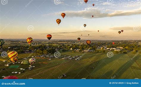 Aerial View Of Multiple Hot Air Balloons Floating Up During A Morning