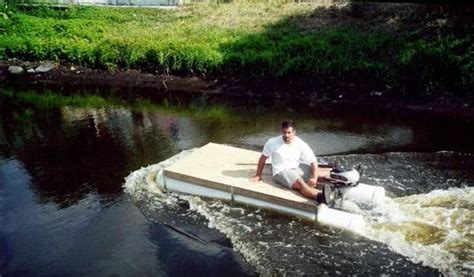 A Man Is Sitting On A Raft In The Water