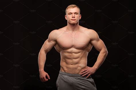 Athletic Handsome Man Fitnessmodel Showing Six Pack Abs Isolated On
