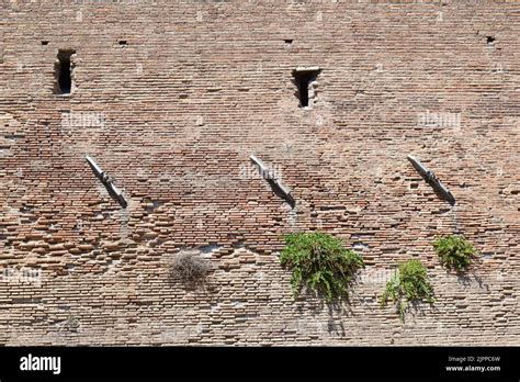 Metal Construction Elements Mounted On An Ancient Roman City Wall To