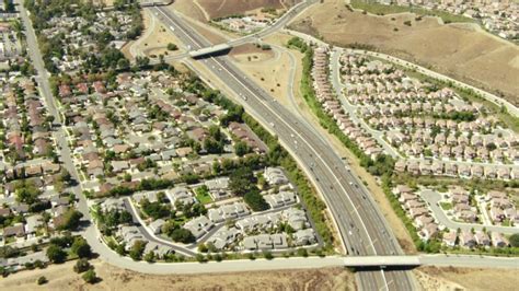 8K Stock Footage Aerial Video Flying Over Simi Valley Hills Towards San