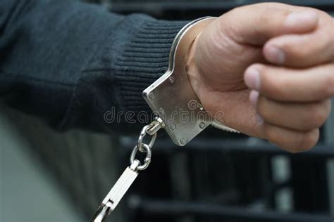 A Police Officer Handcuffs A Suspect Stock Photo Image Of Hand