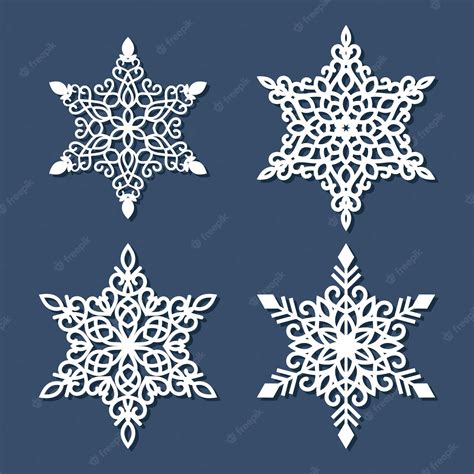 Premium Vector | Set of laser cutting snowflakes isolated on blue