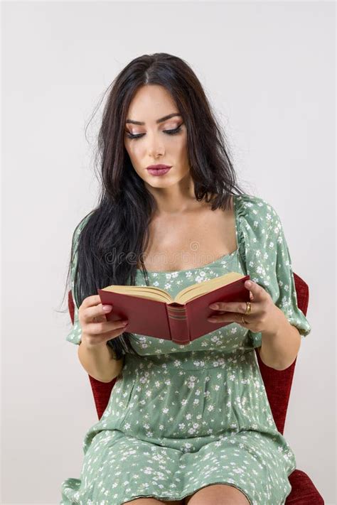 A Beautiful Woman With Long Hair Reading A Book Stock Photo Image Of Casual Brunette