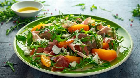 Why Wolfgang Puck Dresses Salad On A Sheet Pan Before Plating