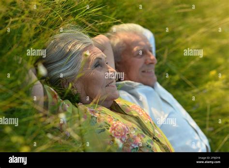 Mature Woman Lying On Grass Hi Res Stock Photography And Images Alamy