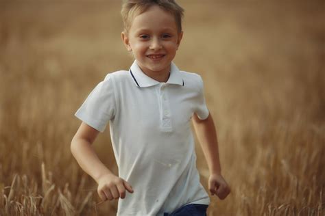 Premium Photo Boy Runs Through A Wheat Field
