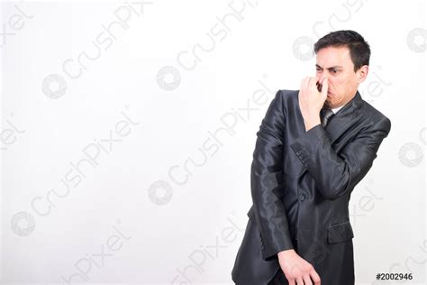 Man In Suit Disgusted By Bad Smell Stock Photo 2002946 Crushpixel