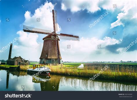 Traditional Dutch Windmill Near The Canal Netherlands Stock Photo