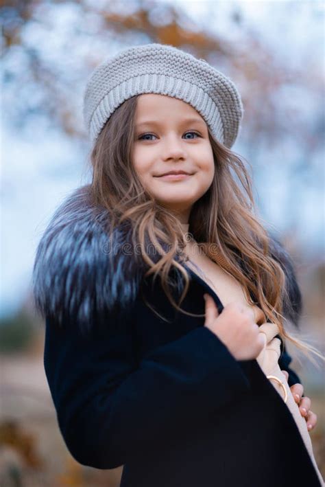 A Beautiful Cute Blonde Girl In An Autumn Garden Stock Image Image Of Head Fall