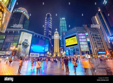 People Stroll Through The Jiefangbei Cbd Pedestrian Mall In Chongqing