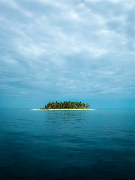 Download Isle In Ocean Blue Waters Wallpaper | Wallpapers.com