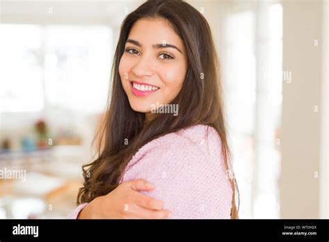 Beautiful Brunette Woman Smiling Cheerful Looking Happy And Positive With Crossed Arms Stock