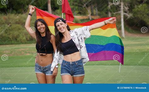 Spanish Lesbian Couple Posing In A Golf Field With A Pride Flag Stock Photo Image Of Pride
