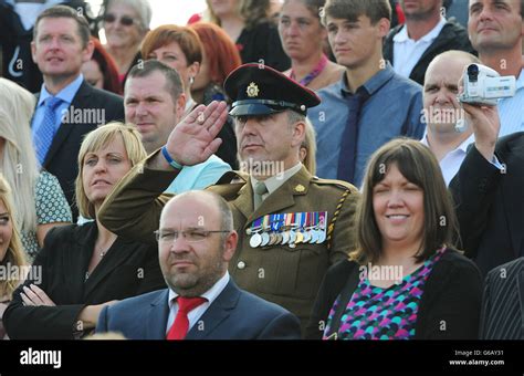 Friends And Families Look On During The Graduation Parade At The Army