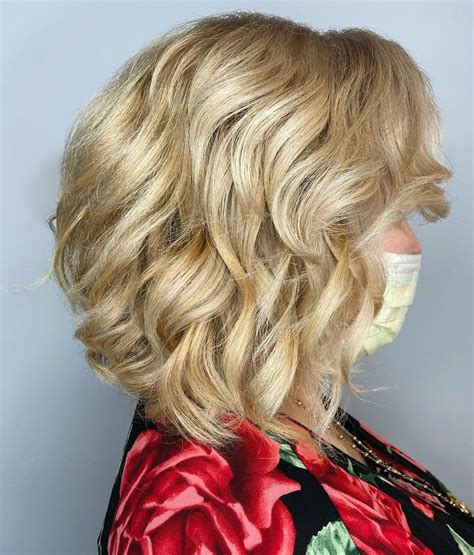 medium curly haircuts for women over 50