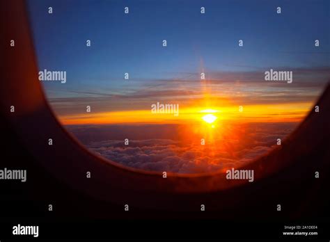 sunset view from airplane window Stock Photo - Alamy