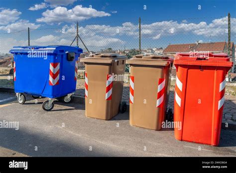 Bins For Separate Waste Collection Of Various Colors At Italian