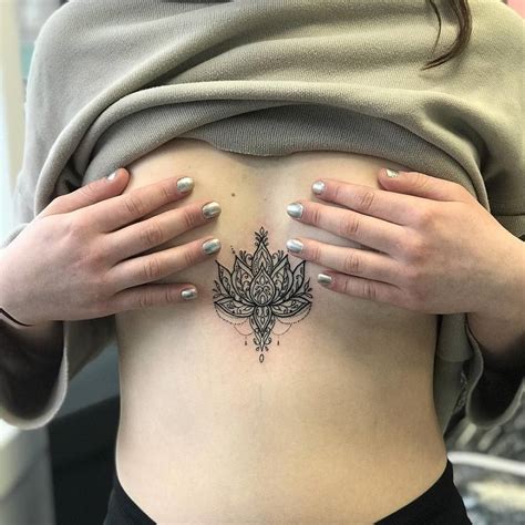 Ornamental Lotus Flower Tattoo On The Sternum