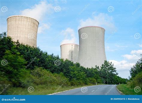 Three Chimneys Of Nuclear Power Plant Near The Road Stock Image Image