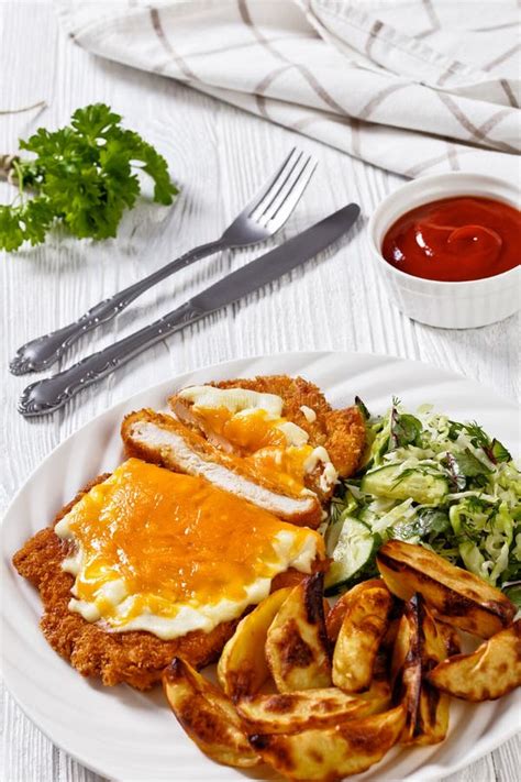 Chicken Parmo with Coleslaw and Roast Potatoes Stock Image - Image of ...