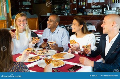 Group of Happy People Eating Pizza with Wine in Restaurant Stock Image - Image of girlfriend ...