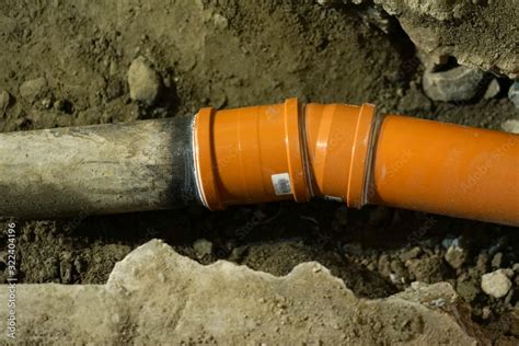 Replacing Old Cast Iron Sewer Pipe With New Pvc Pipe Stock Photo