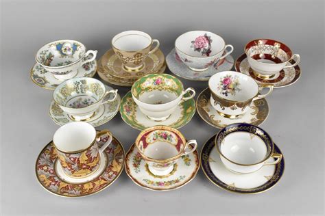 A Collection Of Various Cabinet Cups And Saucers To Include Examples By