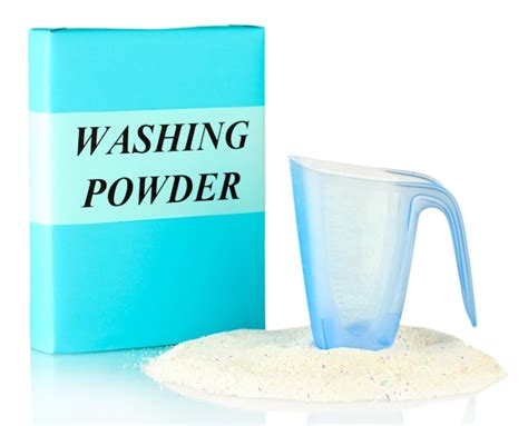 Premium Photo Box Of Washing Powder With Blue Measuring Cup Isolated