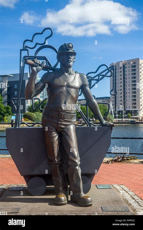 Sculpture Of Welsh Coal Miner In Cardiff Bay South Wales Stock Photo