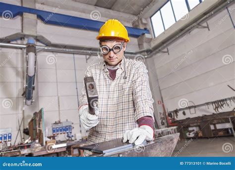 Metalworker Works Metal With Hammer On The Anvil Stock Image Image Of